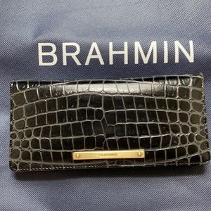 This new Brahmin wallet has 12 card slots.  New without tags.  A Beautiful gift
